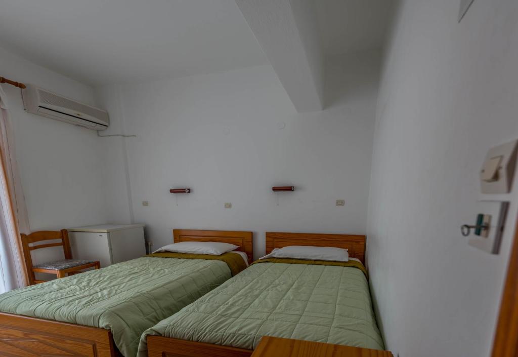 Postel nebo postele na pokoji v ubytování Balaskas Hotel