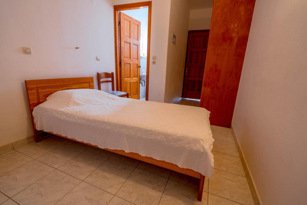 Postel nebo postele na pokoji v ubytování Balaskas Hotel