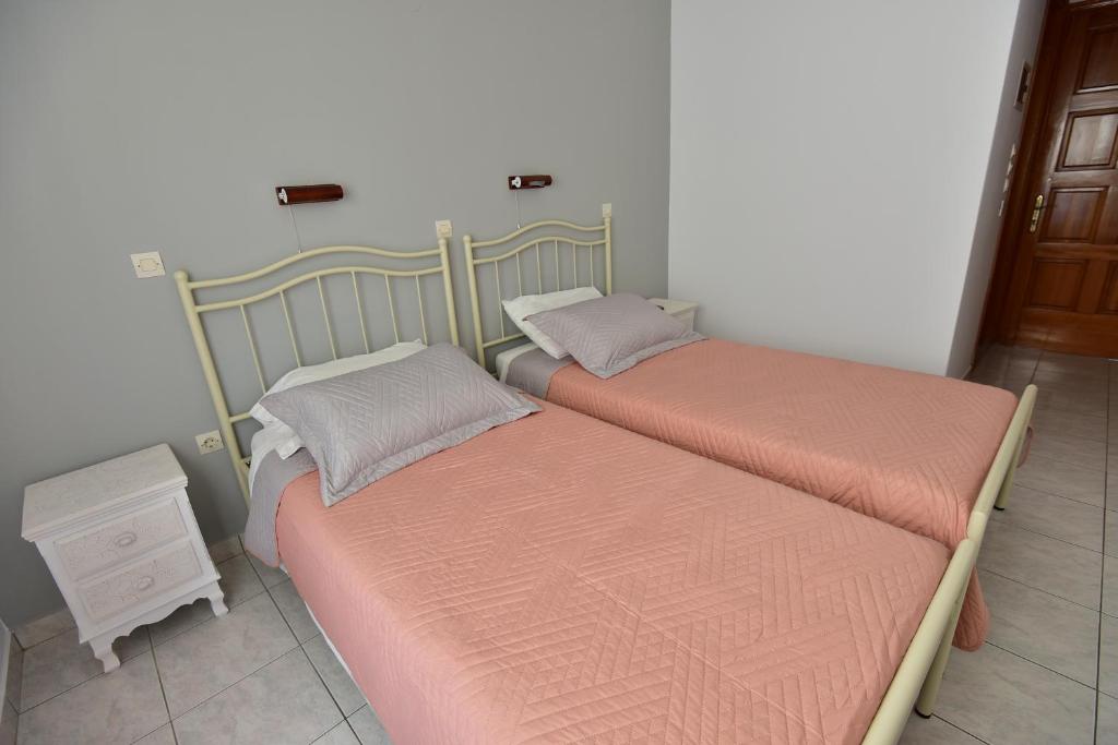 Postel nebo postele na pokoji v ubytování Balaskas Hotel