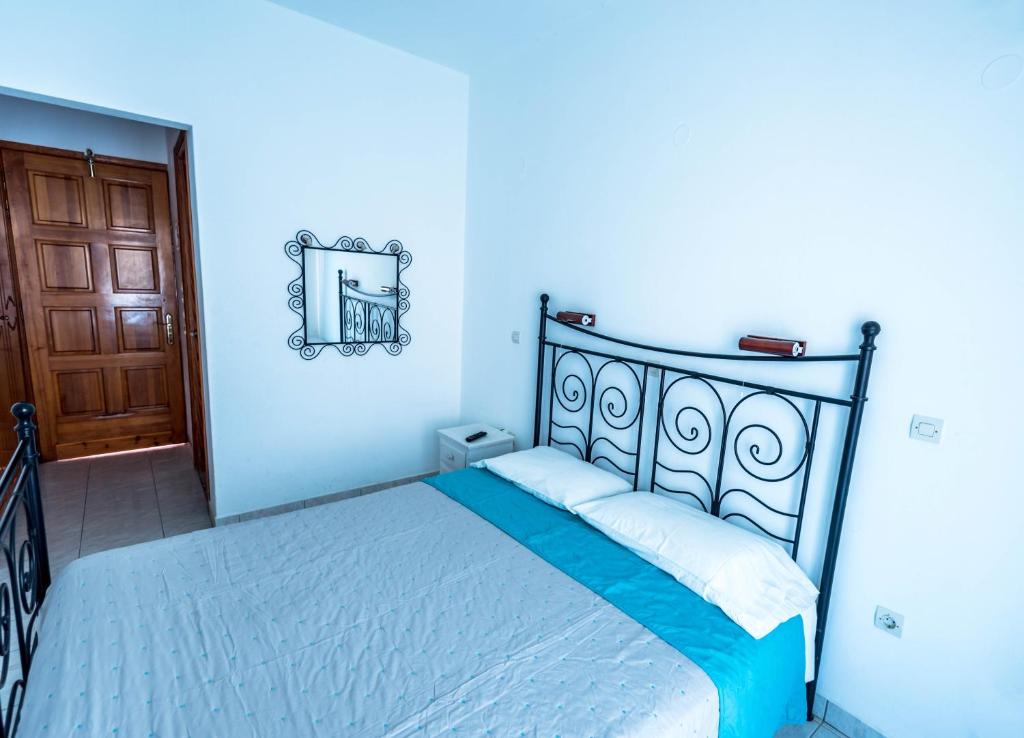 Postel nebo postele na pokoji v ubytování Balaskas Hotel