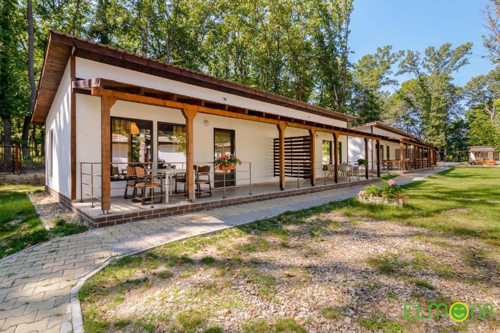a small house with a porch and a patio at Elmona Villas in Kamchia