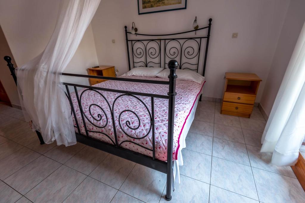 Postel nebo postele na pokoji v ubytování Balaskas Hotel
