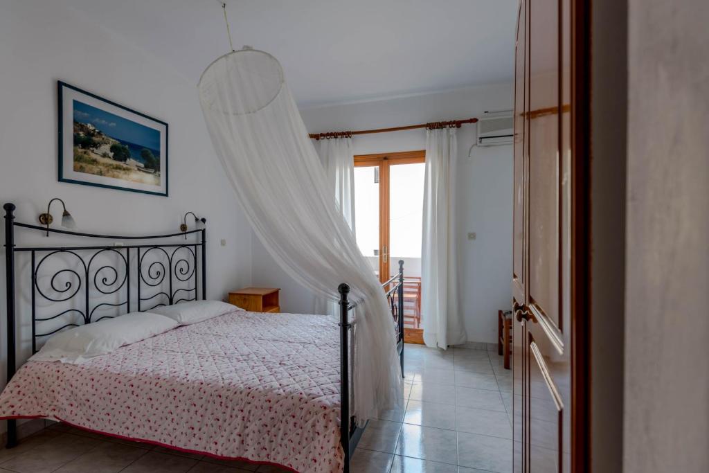 Postel nebo postele na pokoji v ubytování Balaskas Hotel