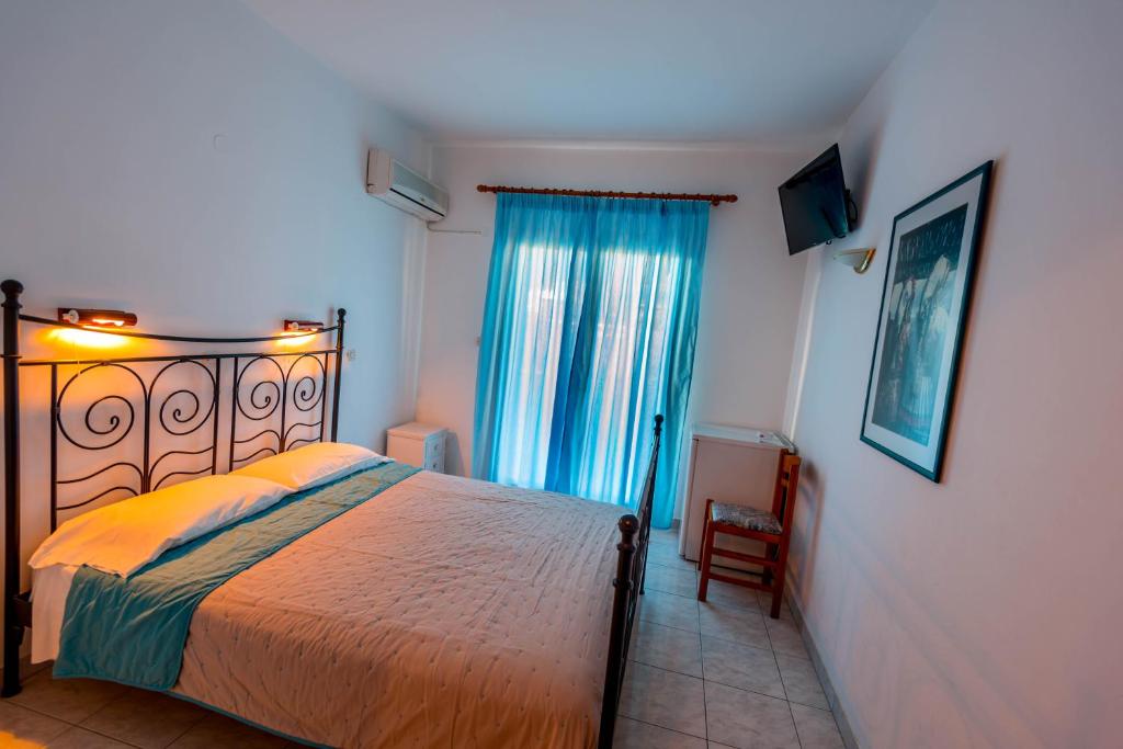 Postel nebo postele na pokoji v ubytování Balaskas Hotel