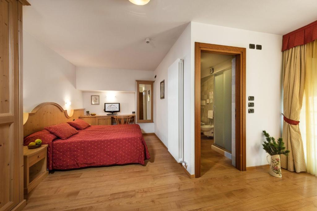 Postel nebo postele na pokoji v ubytování Romantic Charming Hotel Rancolin