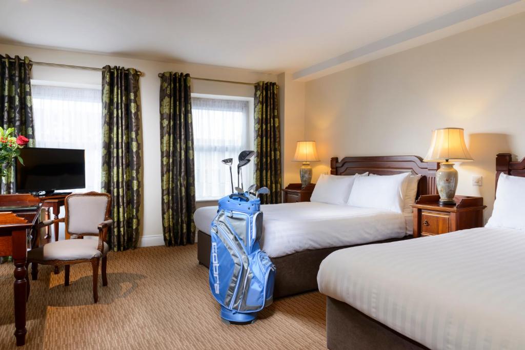 Postel nebo postele na pokoji v ubytování McSweeney Arms Hotel