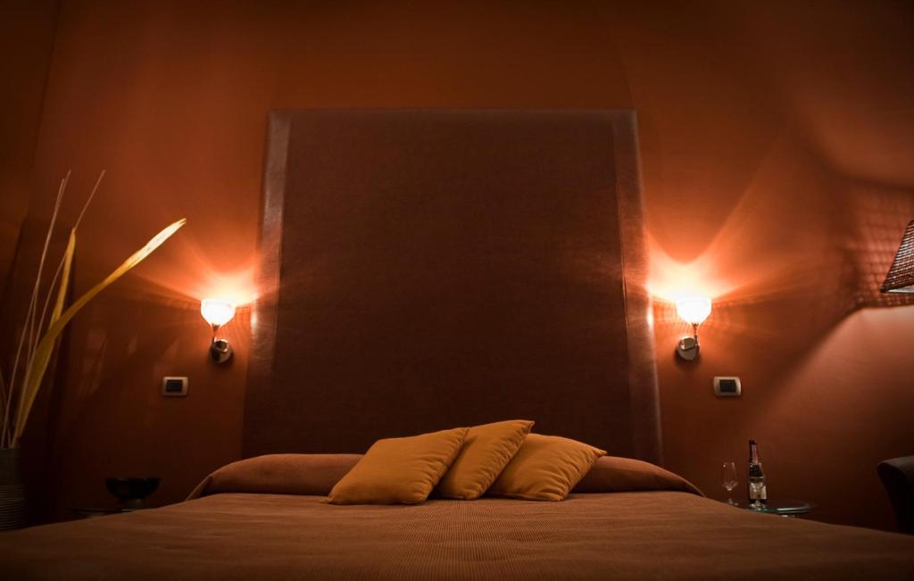 Postel nebo postele na pokoji v ubytování Hotel Aleramo