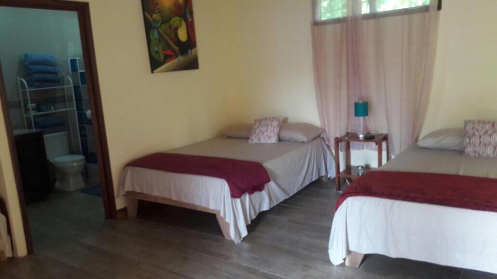 Postel nebo postele na pokoji v ubytování Suites Chile Verde