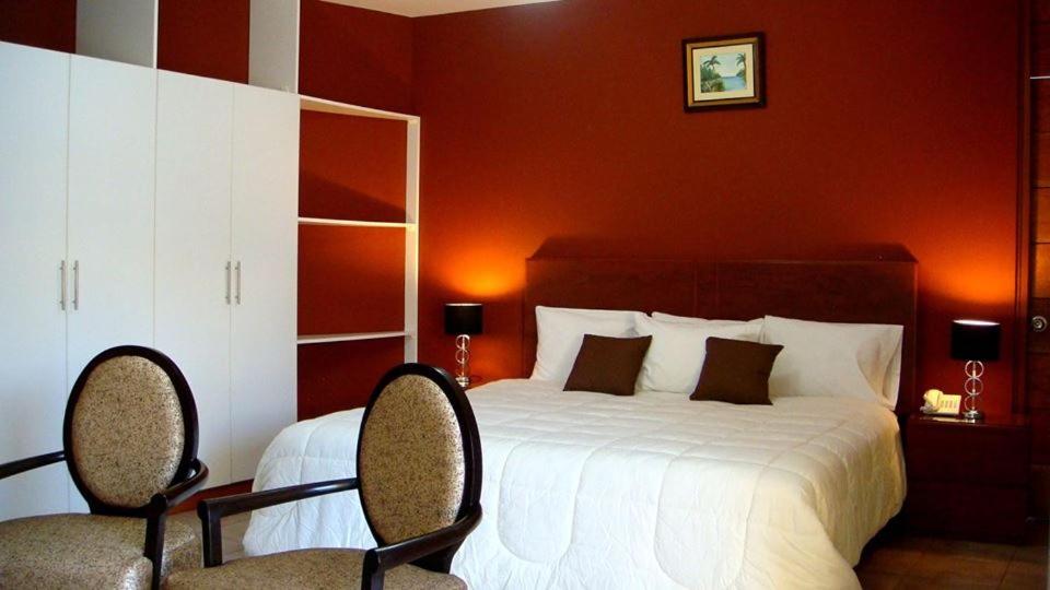 Postel nebo postele na pokoji v ubytování Kajaca Suite Hotel