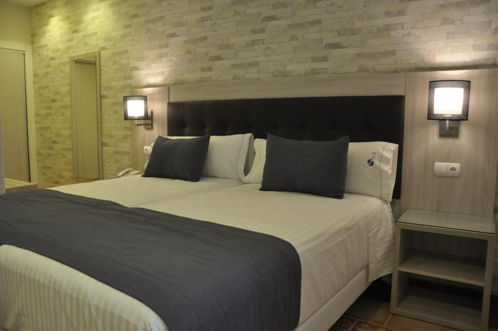 Postel nebo postele na pokoji v ubytování Hotel Selu