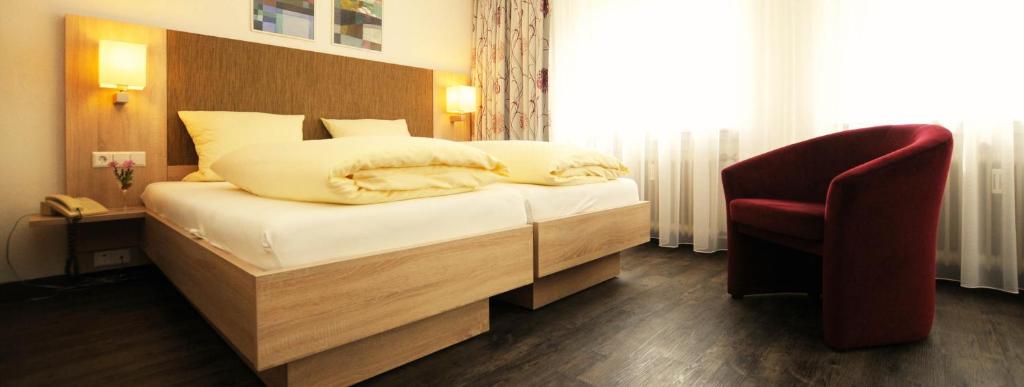 Postel nebo postele na pokoji v ubytování Hotel Ritter