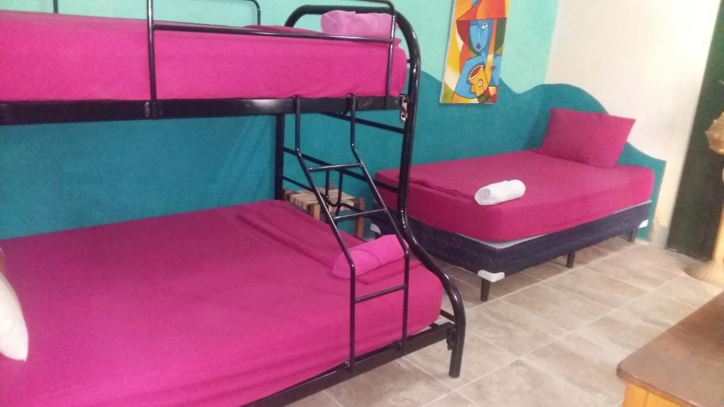 Postel nebo postele na pokoji v ubytování Hostal Mochilas