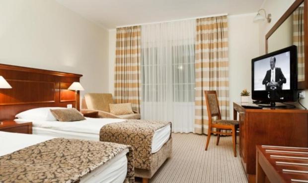Postel nebo postele na pokoji v ubytování Hotel Cateski Dvorec