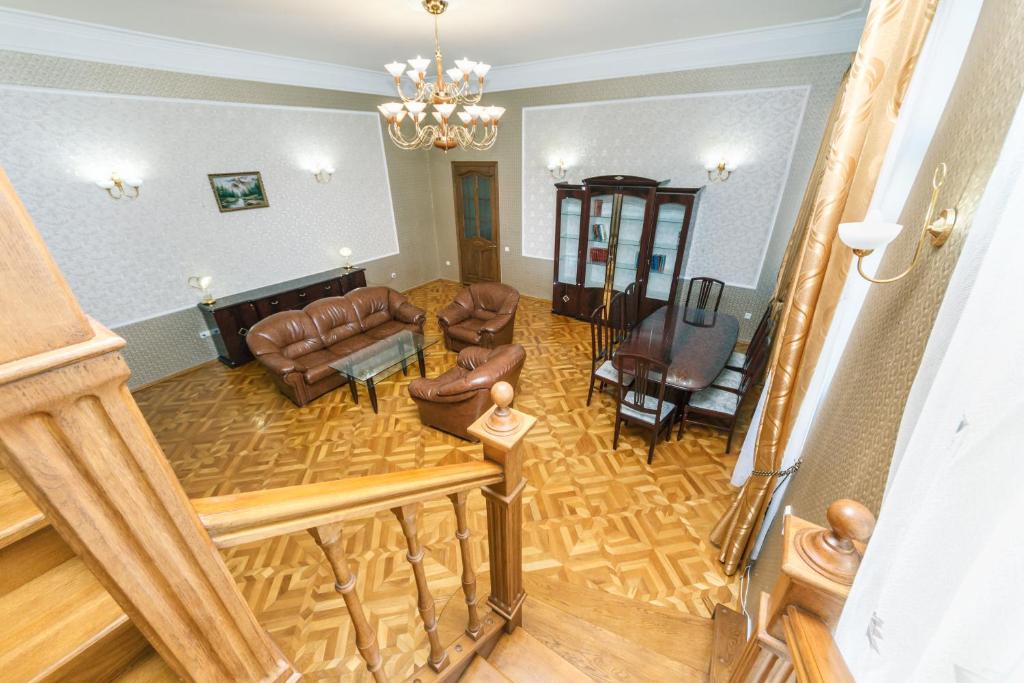 an overhead view of a living room with leather furniture at VIP apartment near Olympic Stadium in Kyiv