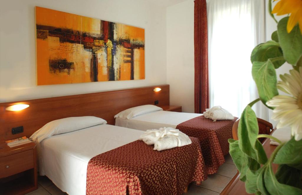 Postel nebo postele na pokoji v ubytování Hotel Scaldaferro