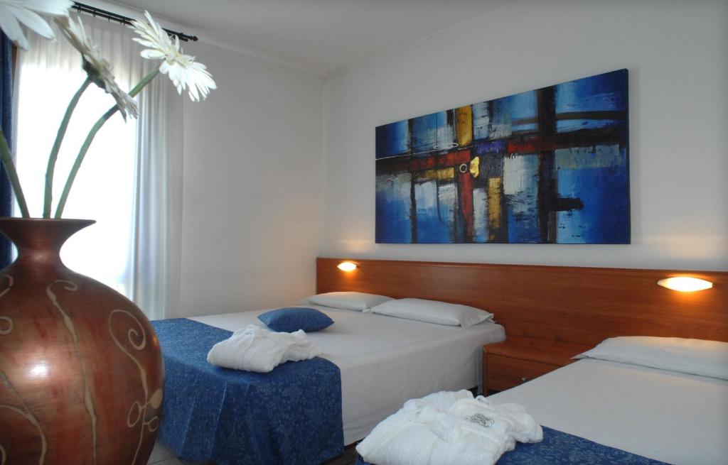 Postel nebo postele na pokoji v ubytování Hotel Scaldaferro
