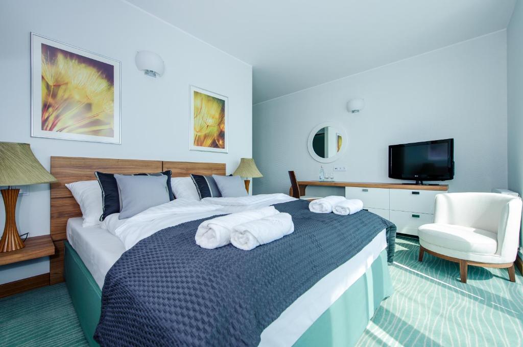 Postel nebo postele na pokoji v ubytování Hotel Active