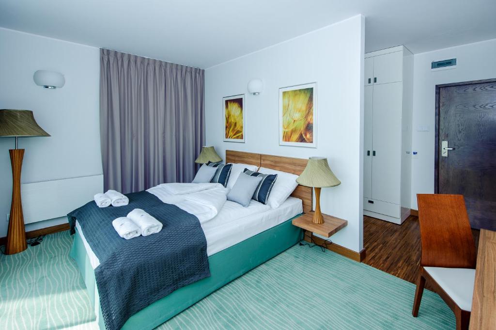 Postel nebo postele na pokoji v ubytování Hotel Active