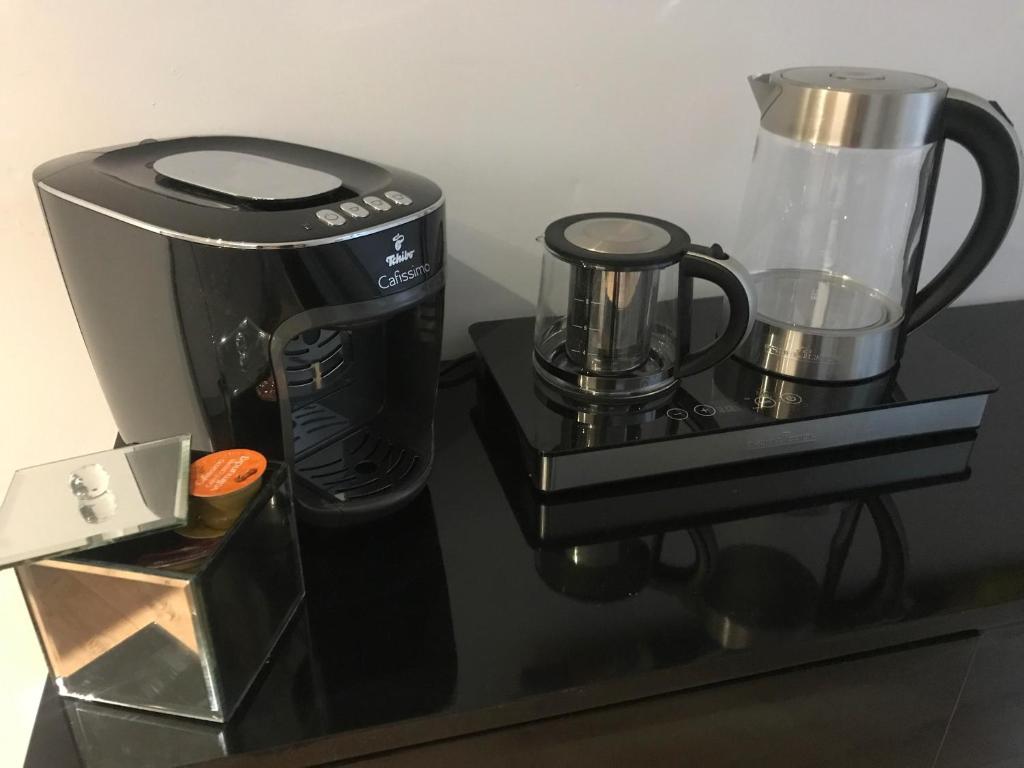 Príslušenstvo na prípravu kávy alebo čaju v ubytovaní Apartament Mozart