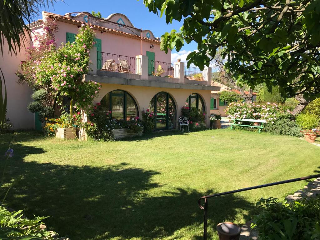 a house with a lawn in front of it at La Bastide Dambrine in Sanary-sur-Mer