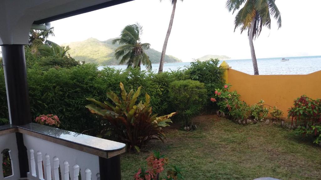 a view of the ocean from the balcony of a house at Maison Belle Baie in Baie Sainte Anne
