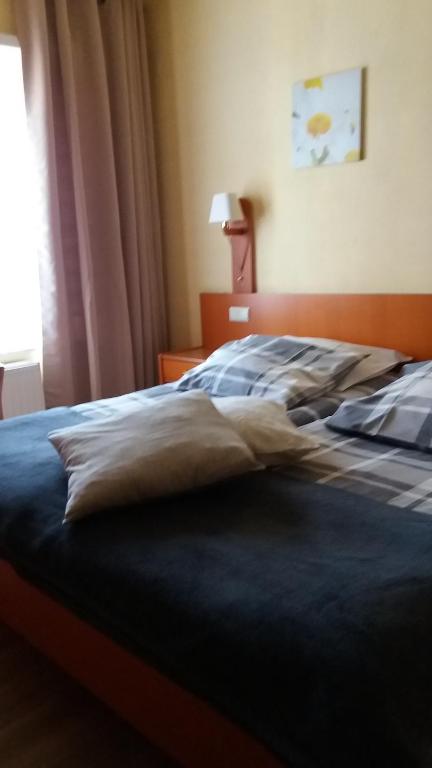 Postel nebo postele na pokoji v ubytování Hotel 'T Hert