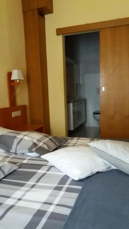 Postel nebo postele na pokoji v ubytování Hotel 'T Hert