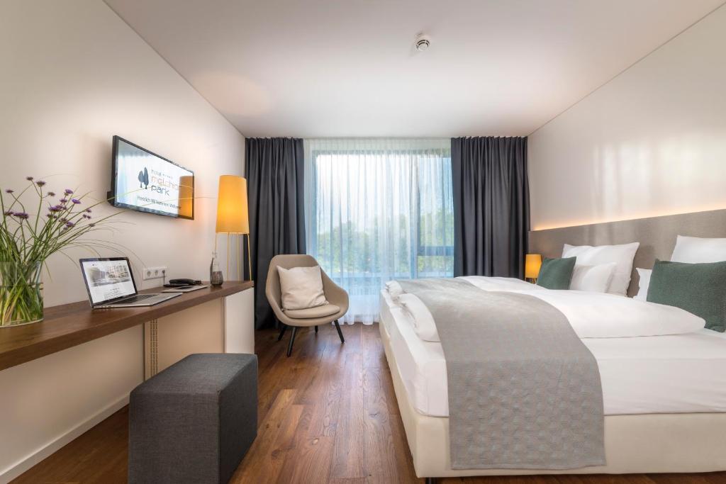 Postel nebo postele na pokoji v ubytování Hotel Melchior Park