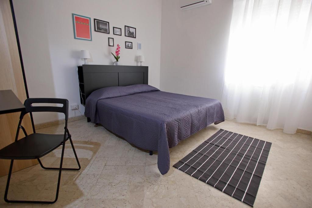 Postel nebo postele na pokoji v ubytování Dimora Hostel