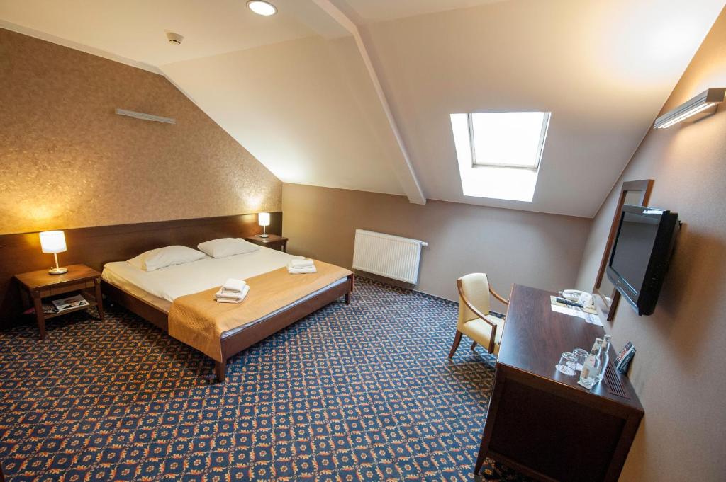 Posteľ alebo postele v izbe v ubytovaní Hotel Rad