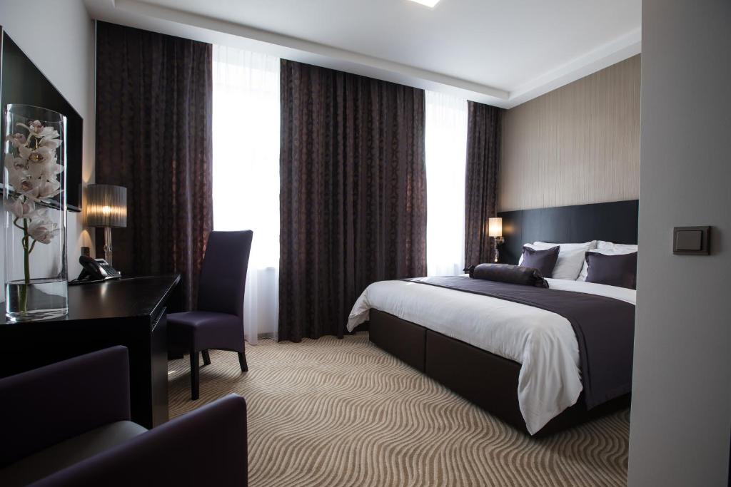 Łóżko lub łóżka w pokoju w obiekcie Myo Hotel Wenceslas