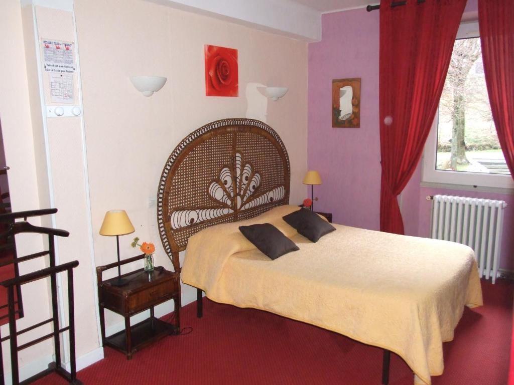 Voodi või voodid majutusasutuse Hôtel du Val d'Aure toas