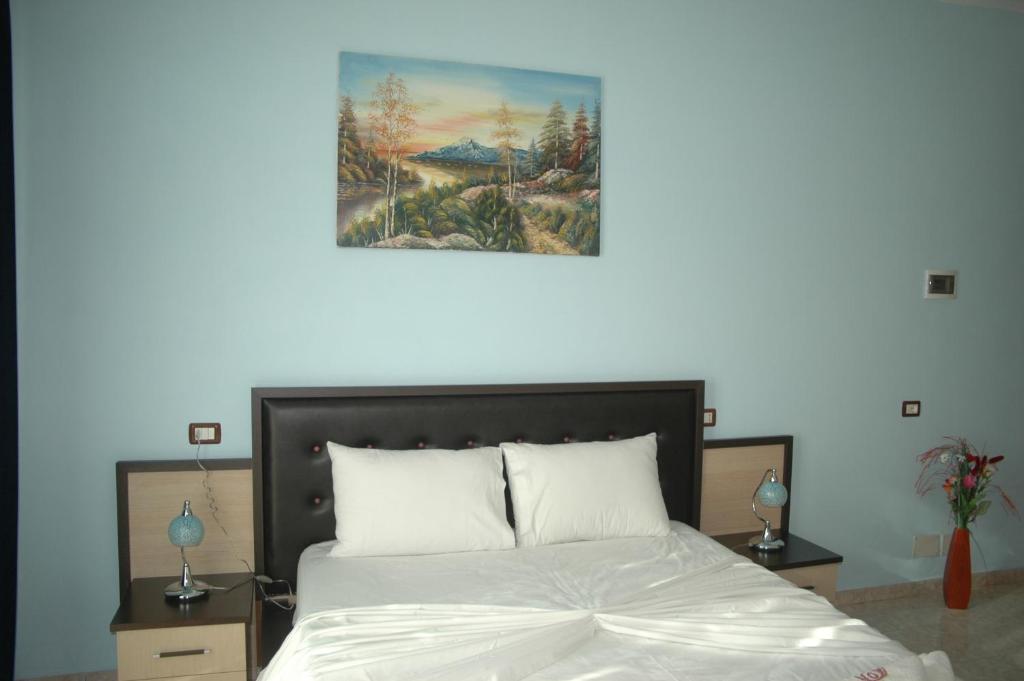 Postel nebo postele na pokoji v ubytování Hotel Aleksandrus Jardin
