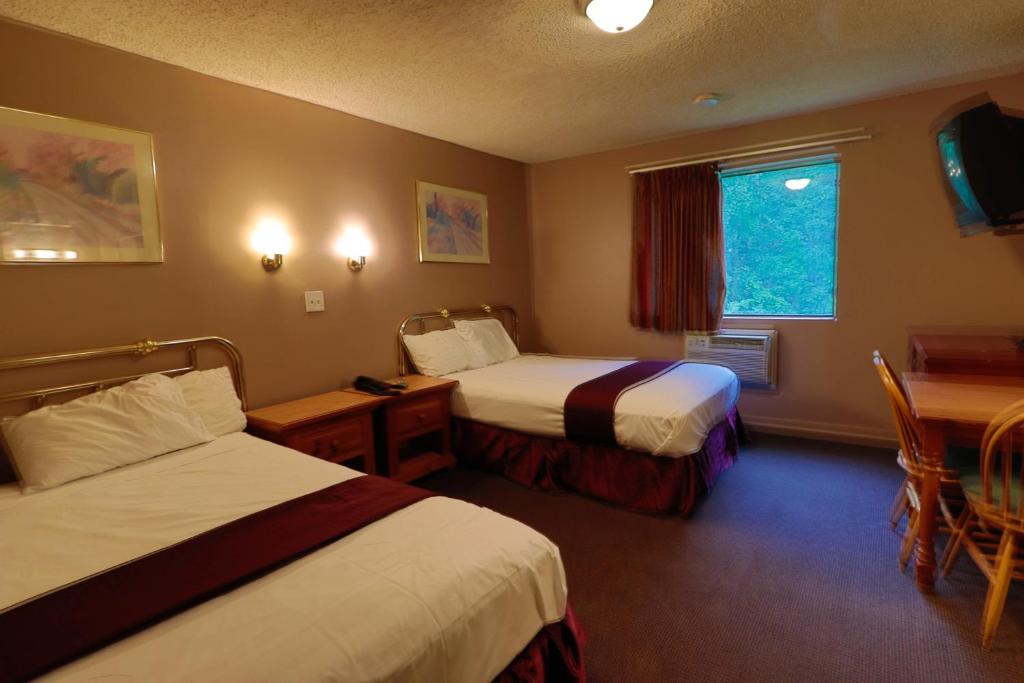 Postel nebo postele na pokoji v ubytování Red Carpet Inn Berlin