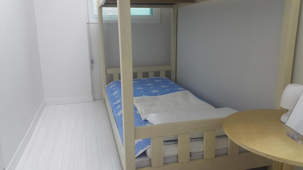 Postel nebo postele na pokoji v ubytování Cobe Guesthouse Dongdaemun