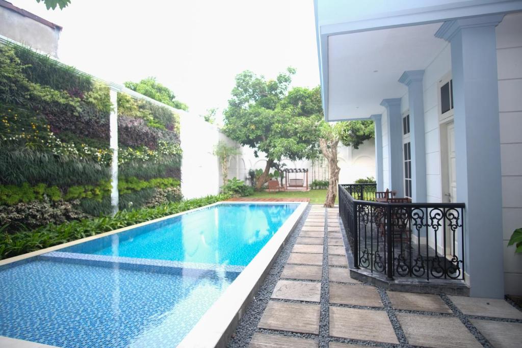 a swimming pool in the backyard of a house at Rumah Kertajaya in Surabaya