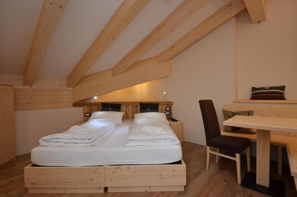 Postel nebo postele na pokoji v ubytování Park Hotel Avisio