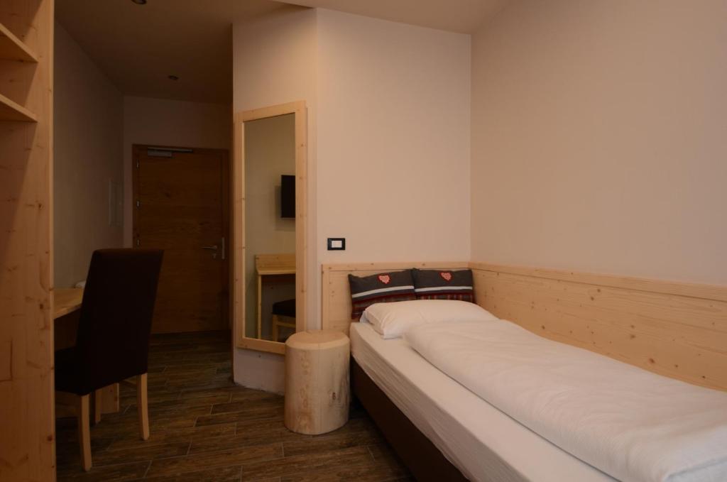 Postel nebo postele na pokoji v ubytování Park Hotel Avisio