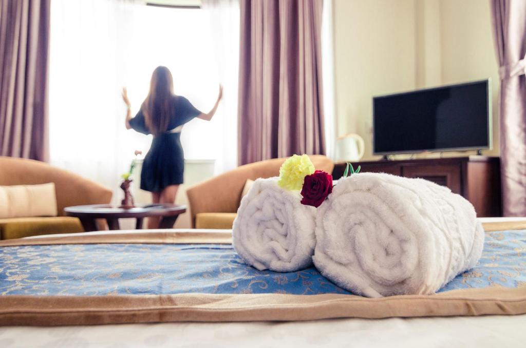 Sjónvarps- og/eða afþreyingartæki á Dahlia Boutique Hotel