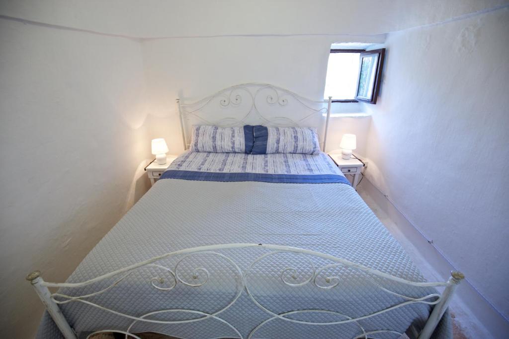 Postel nebo postele na pokoji v ubytování B&B Tenuta Ranieri