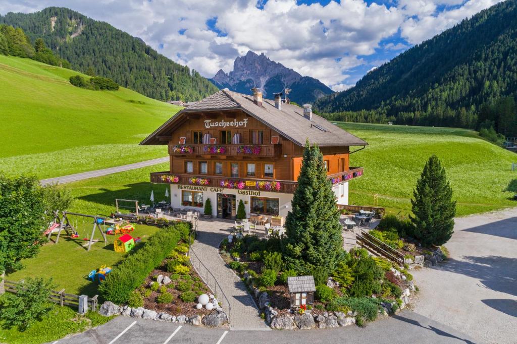 an aerial view of a hotel in the mountains at Gasthof Tuscherhof in Braies