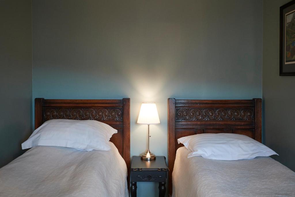 Postel nebo postele na pokoji v ubytování BG4 Guesthouse
