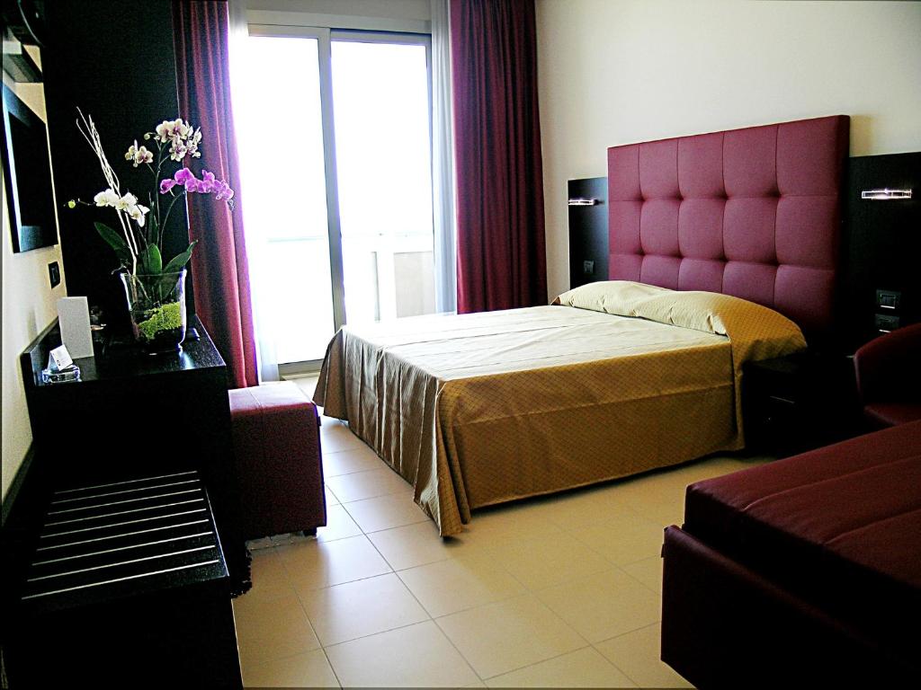 Postel nebo postele na pokoji v ubytování Terminal Palace & SPA