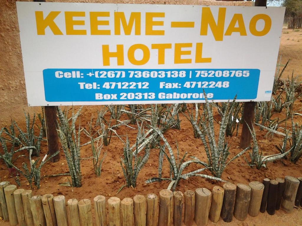 a sign for a kenne na nao hotel at Keeme-Nao Hotel in Mahalapye