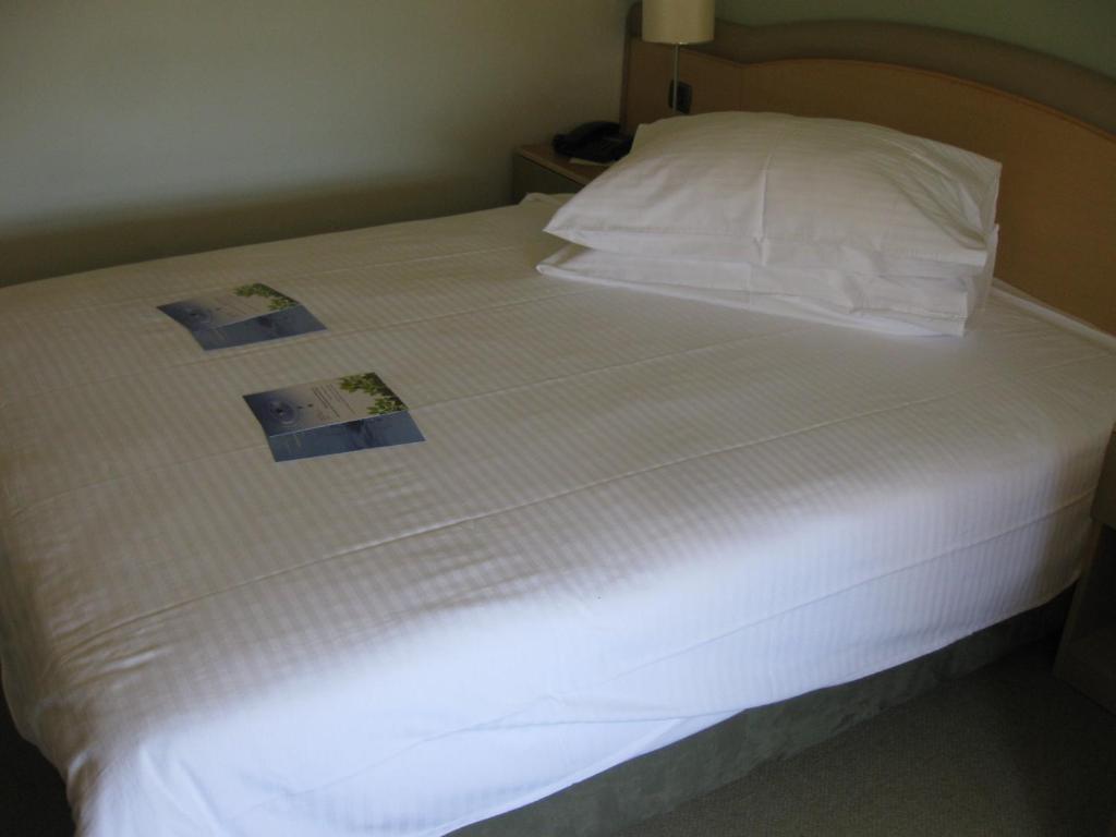 Postel nebo postele na pokoji v ubytování Hotel Kimen
