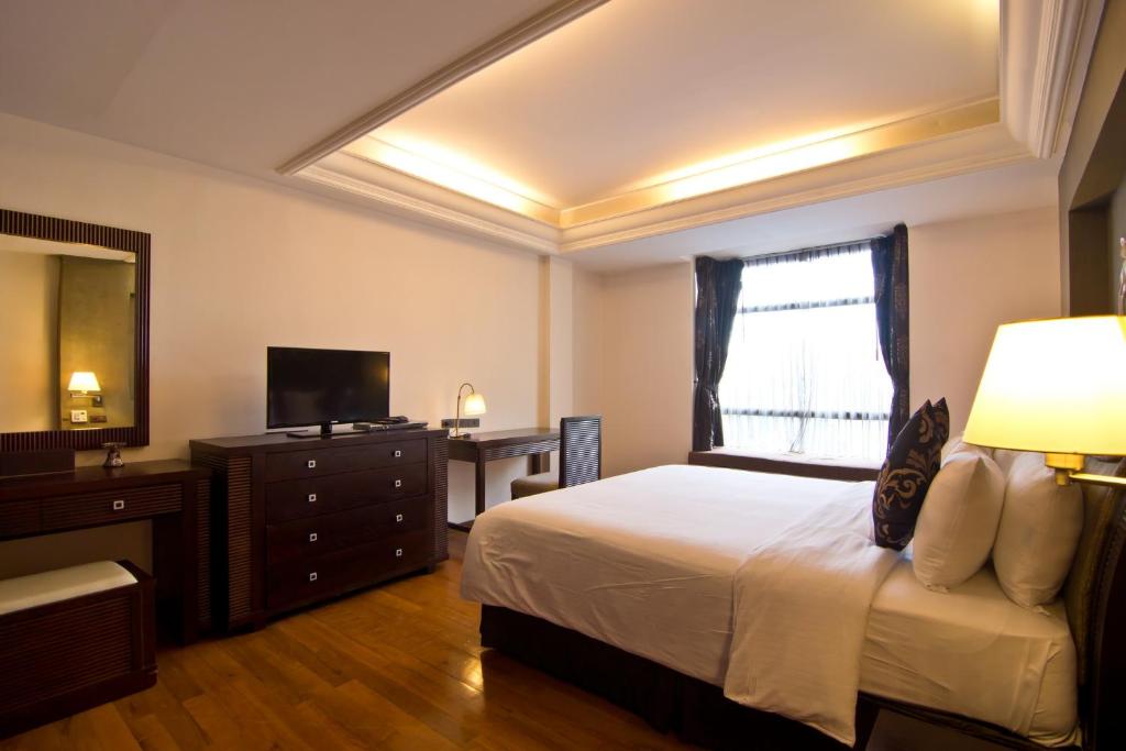 Postel nebo postele na pokoji v ubytování LK Mantra Pura Resort