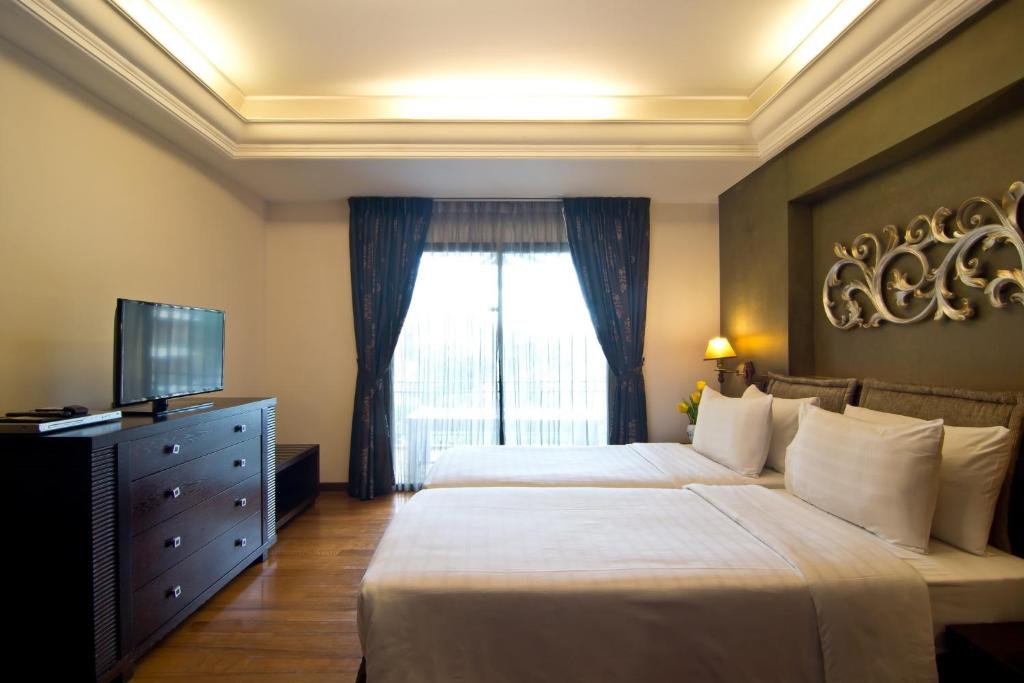 Postel nebo postele na pokoji v ubytování LK Mantra Pura Resort