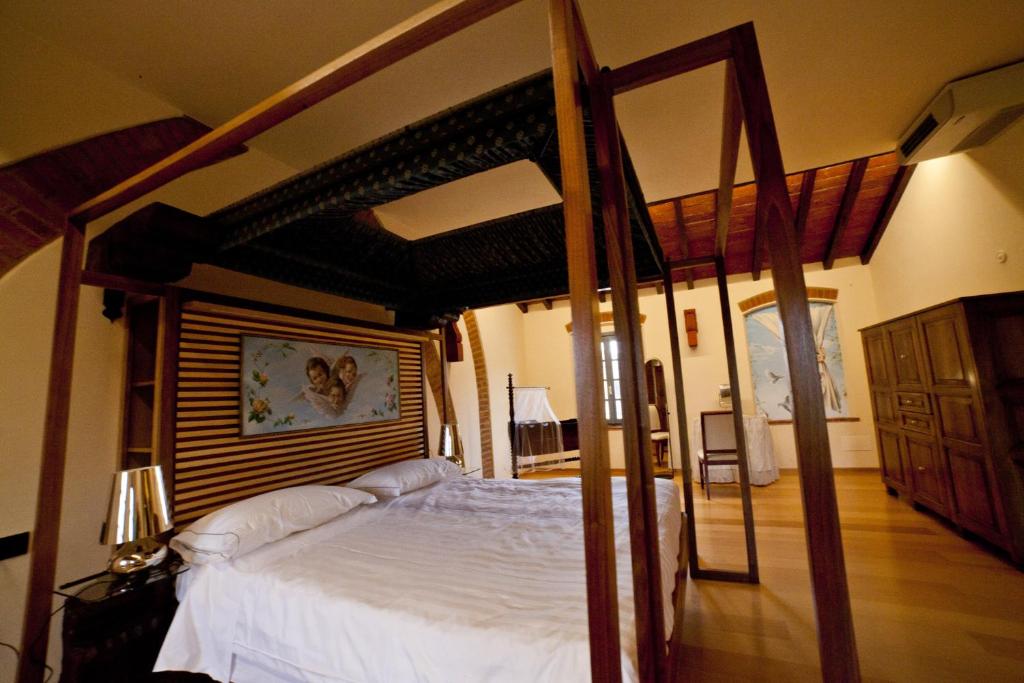 Postel nebo postele na pokoji v ubytování Agriturismo Cascina Farisengo