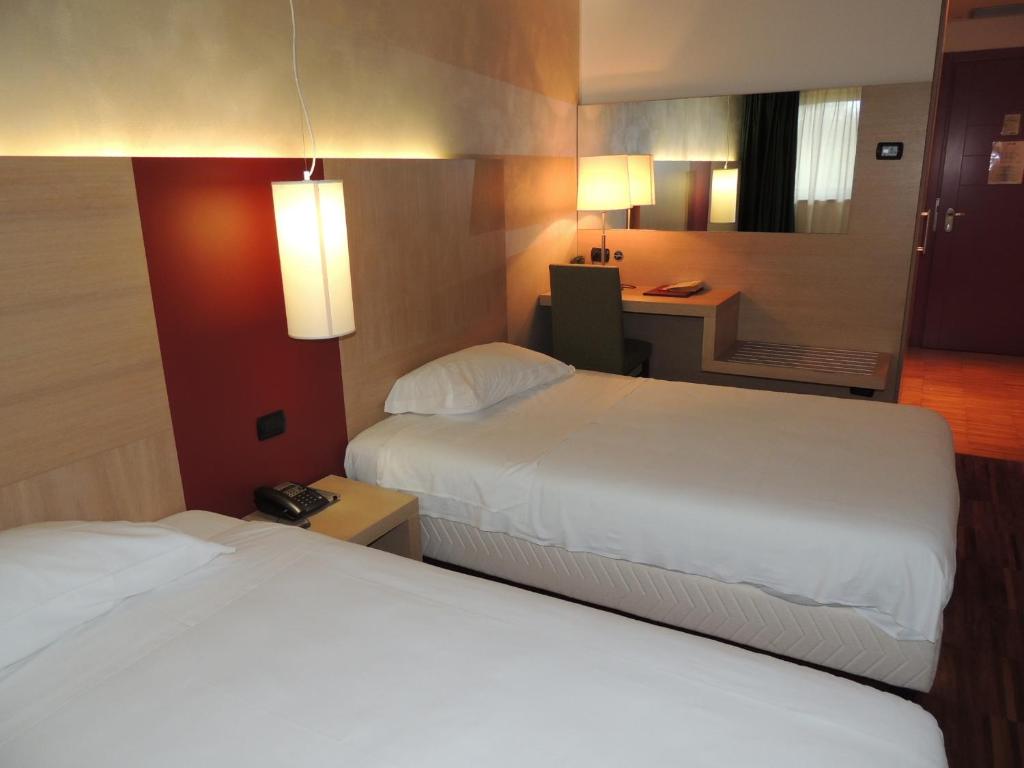 Postel nebo postele na pokoji v ubytování Cascina Scova Resort
