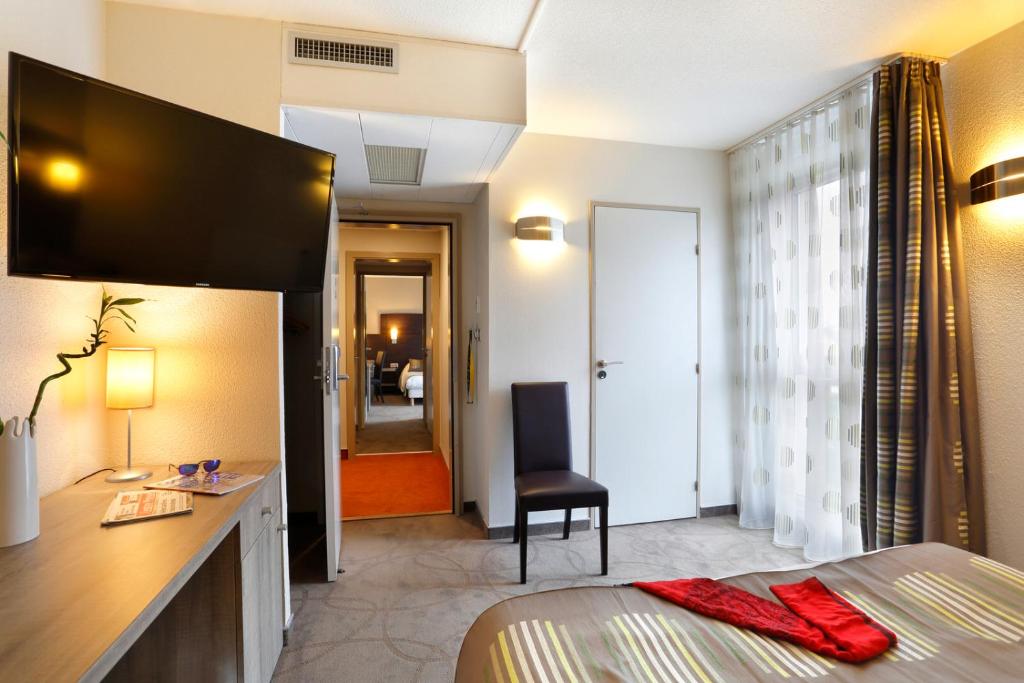 Postel nebo postele na pokoji v ubytování B&B HOTEL Montbéliard-Sochaux